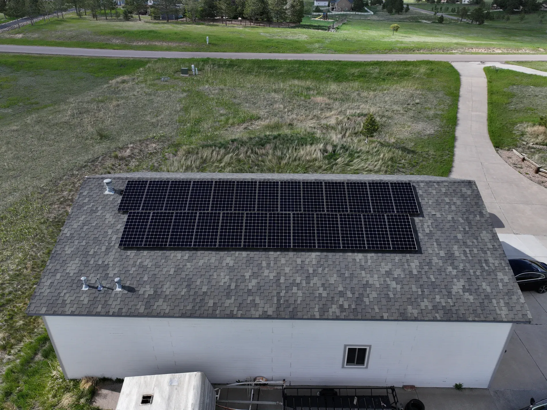 Outbuilding with solar and designer shingles