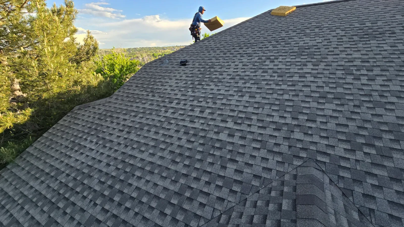 New shingle roof on a Colorado home against the foothills