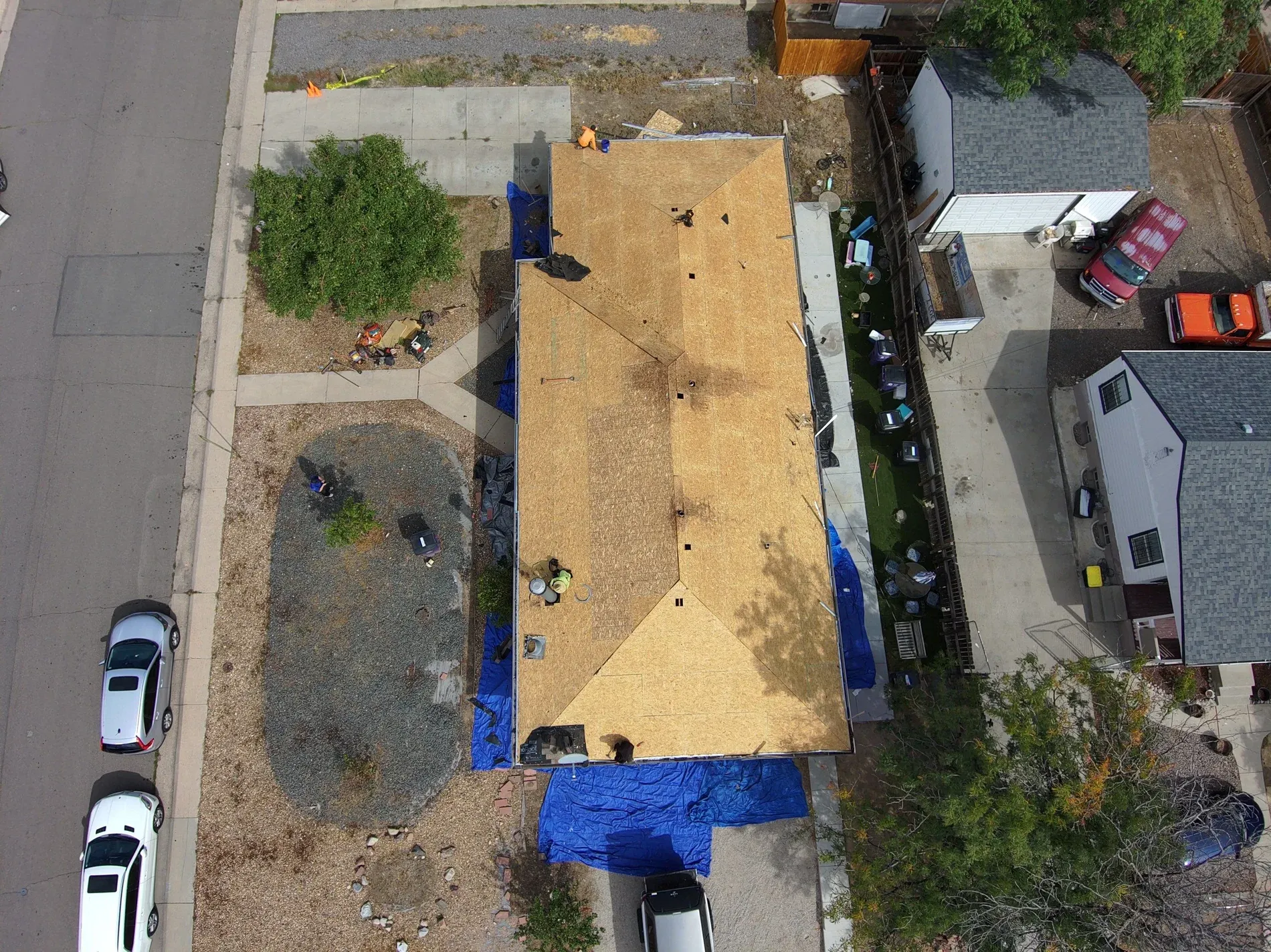 Aerial of full roof tear-off in progress