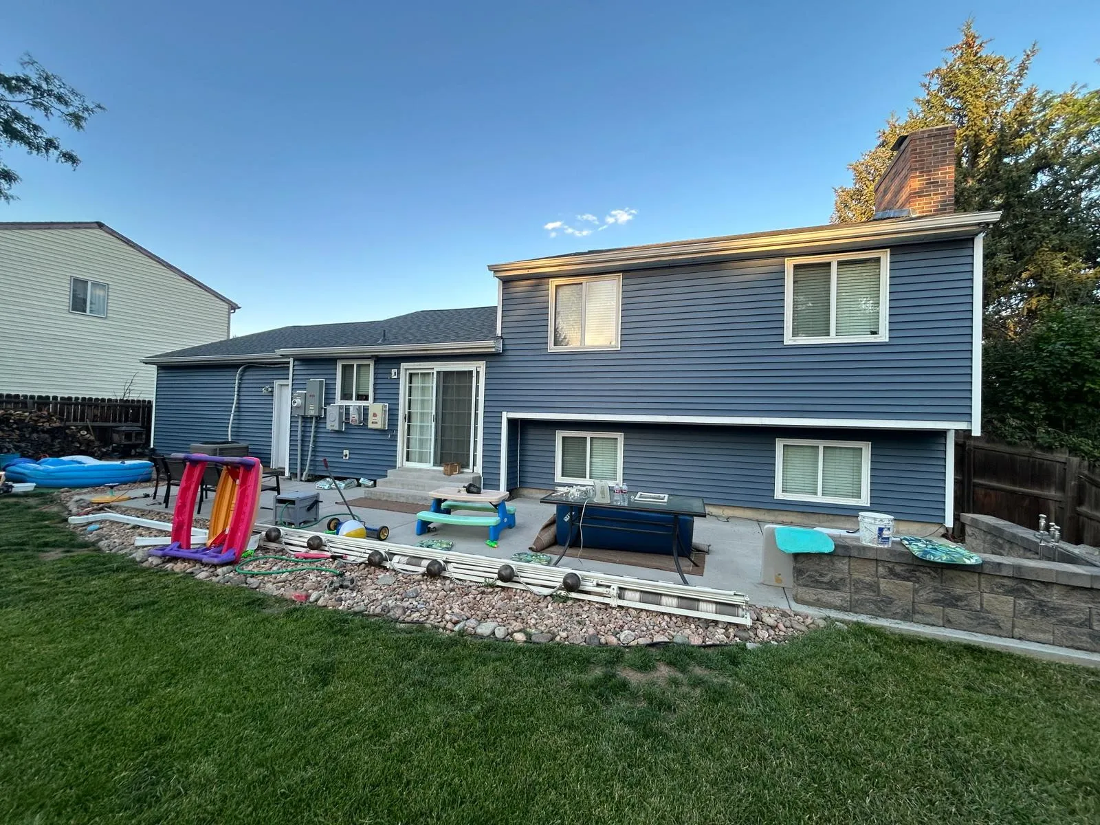 Completed exterior paint — backyard view