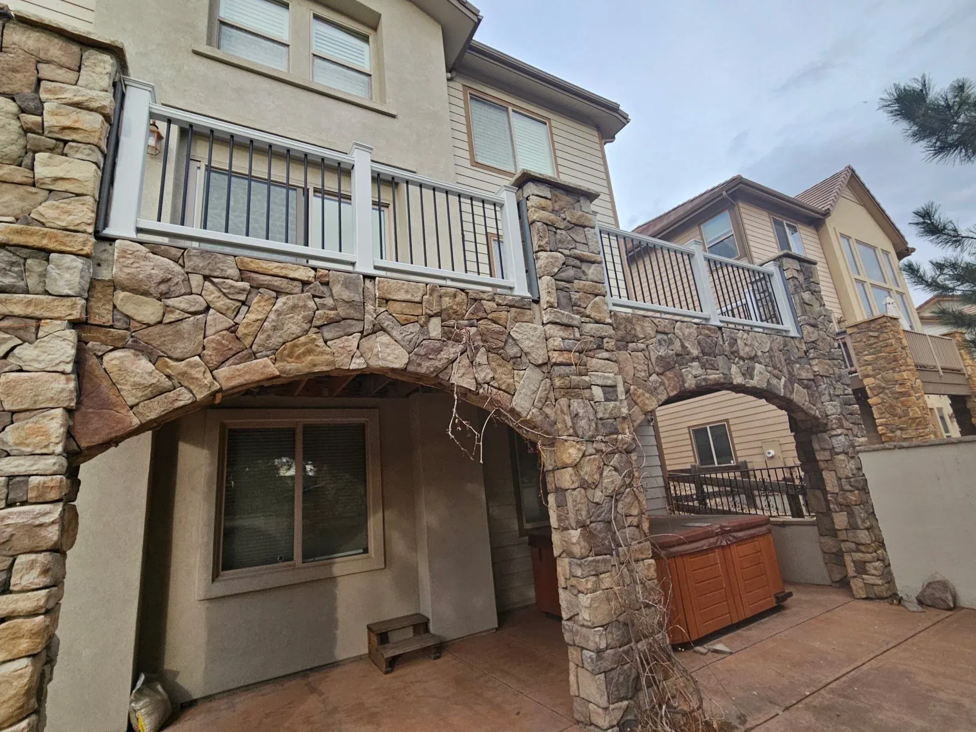 Finished exterior with new deck and stonework