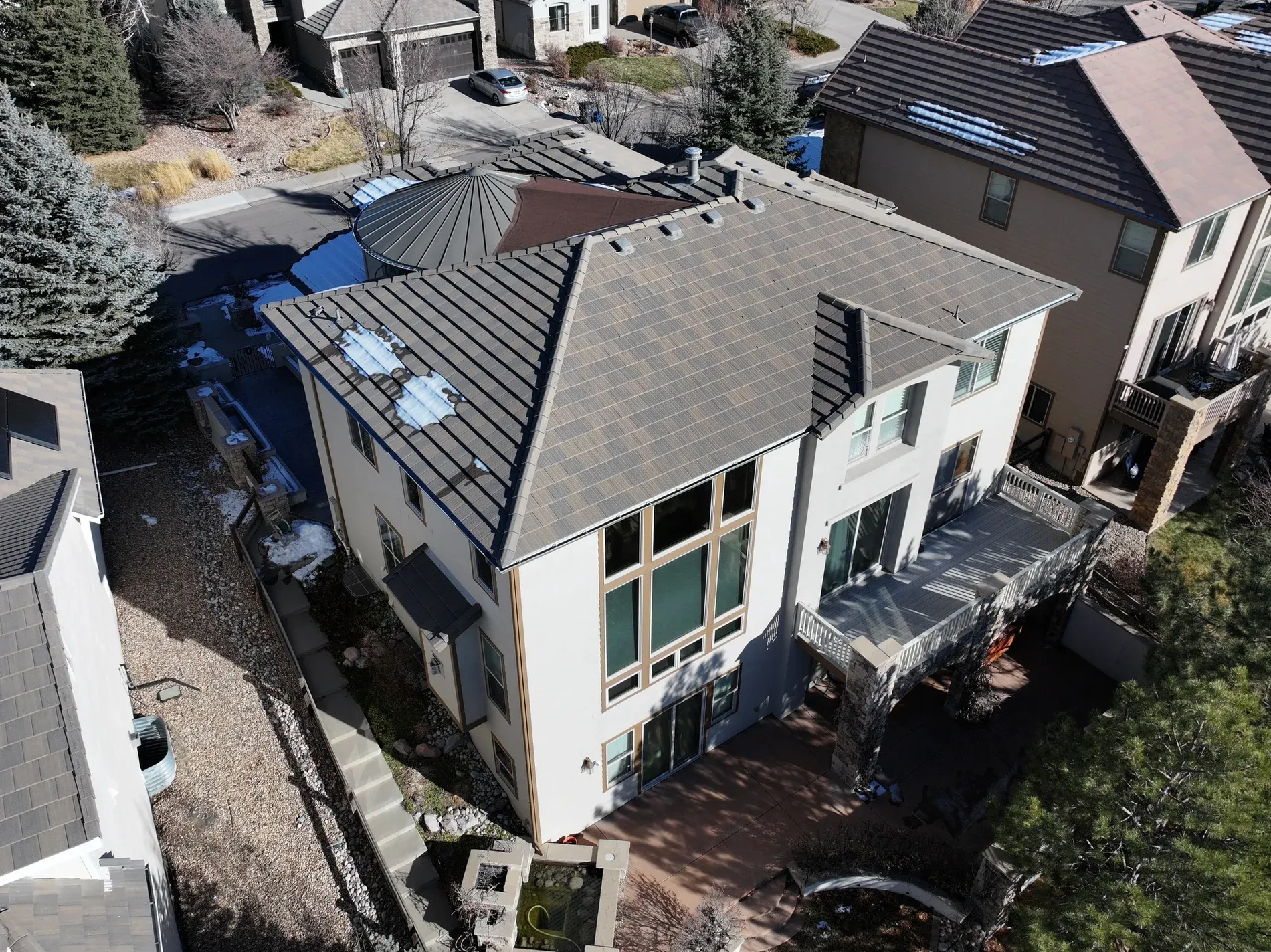 Completed tile roof aerial showing full property